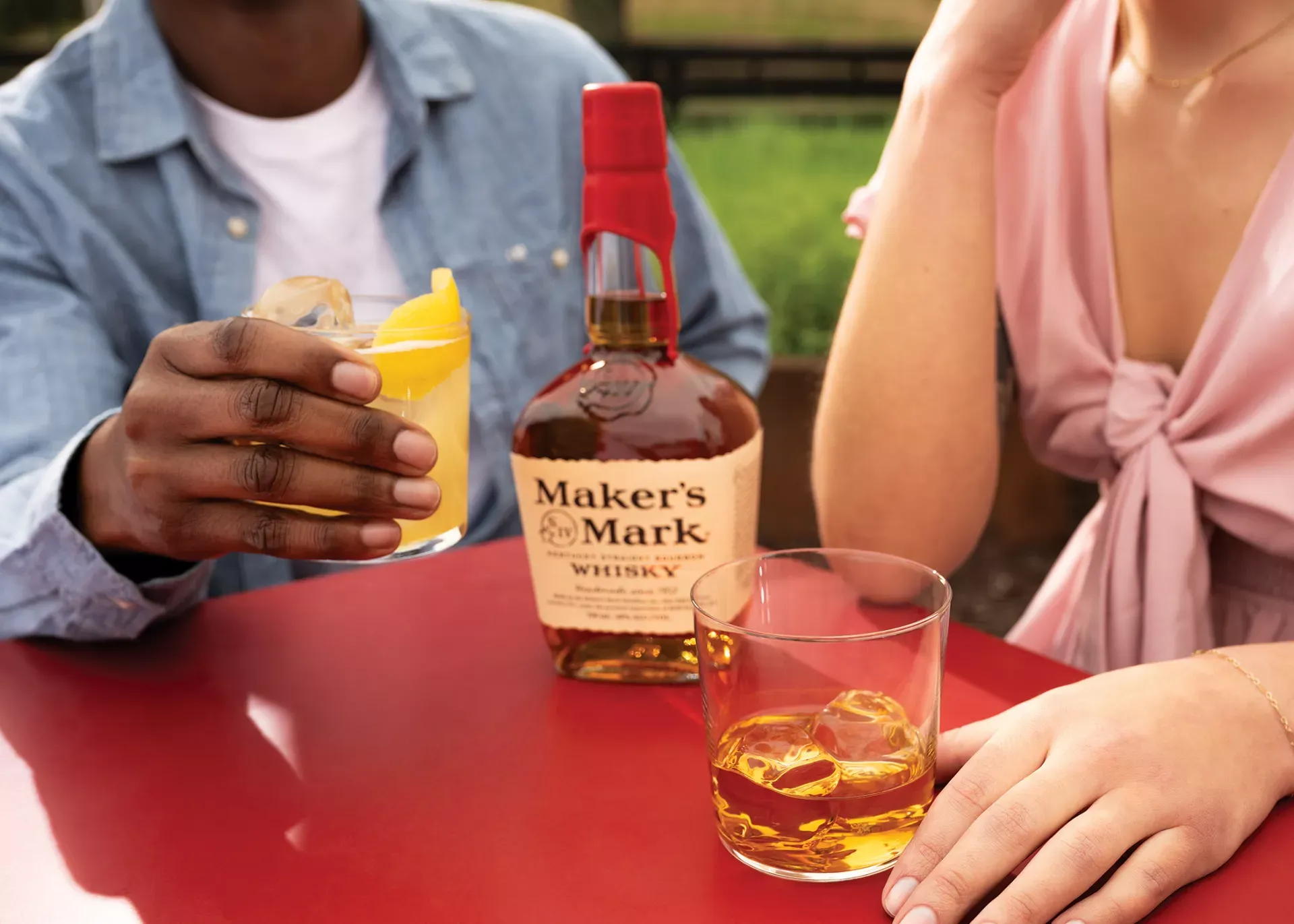 Friends sharing Maker’s Mark bourbon