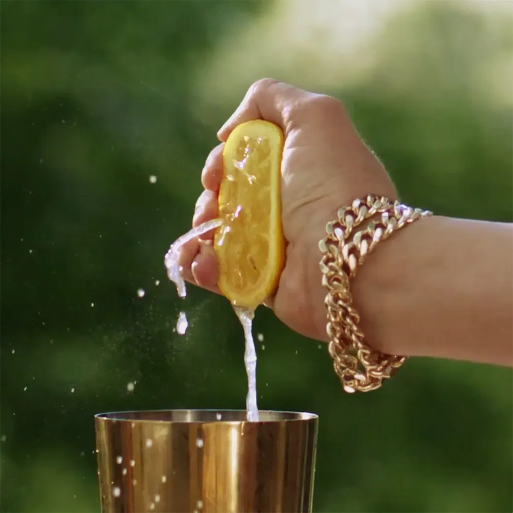 Hand Holding Yuzu Green Background Maker’s Mark