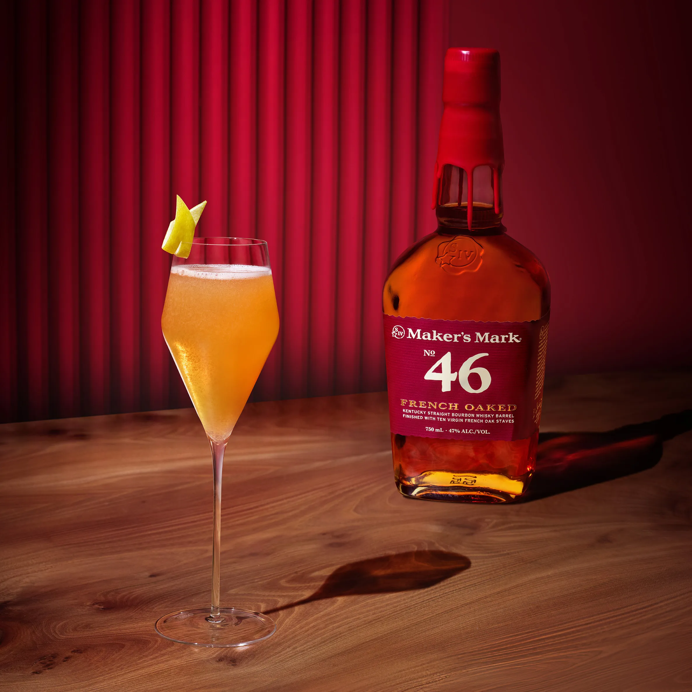 A glass and bottle of French Oaked 75