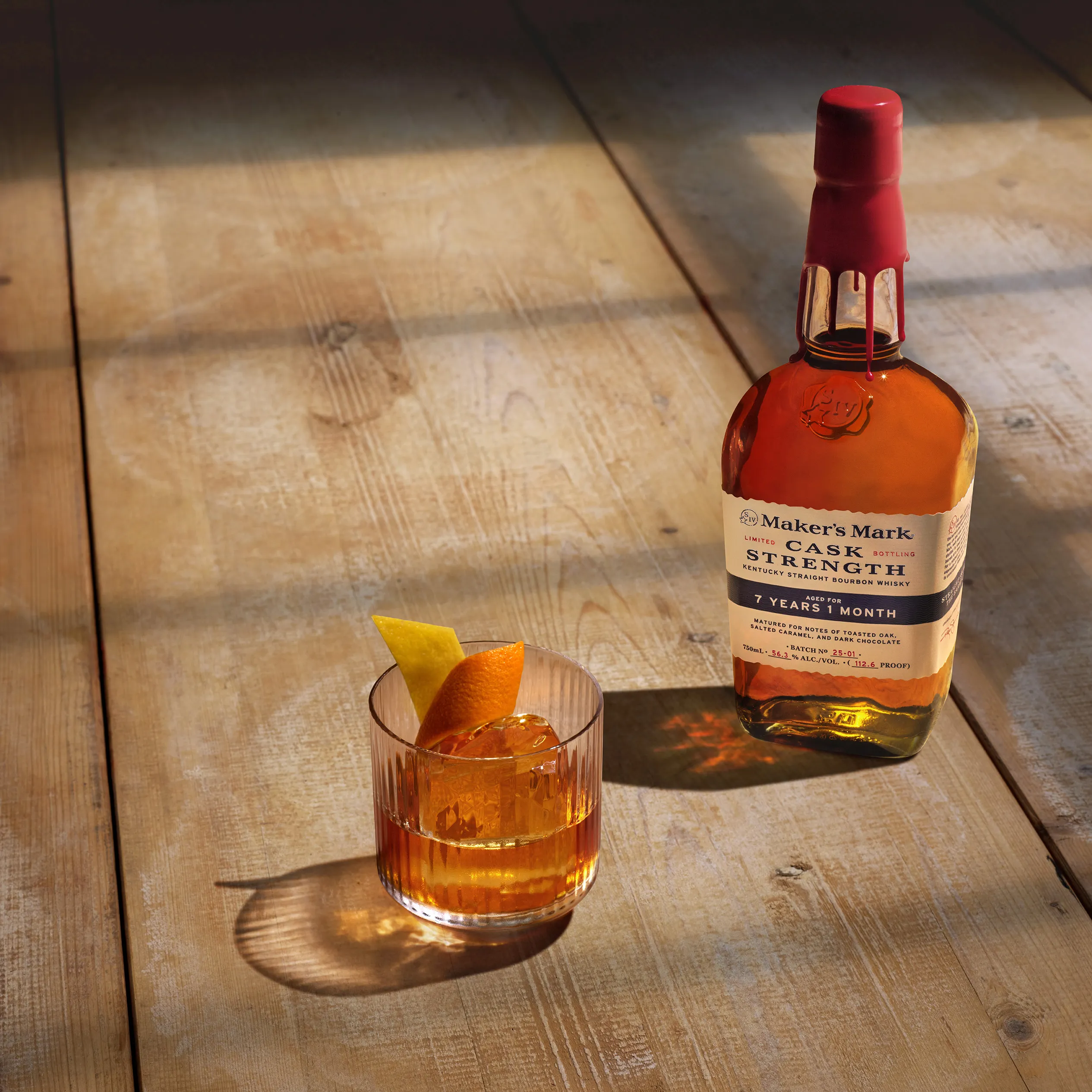 A glass and bottle of old faishoned