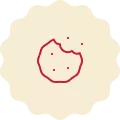 Red icon on a cream-colored background, representing a cookie with crumbles.